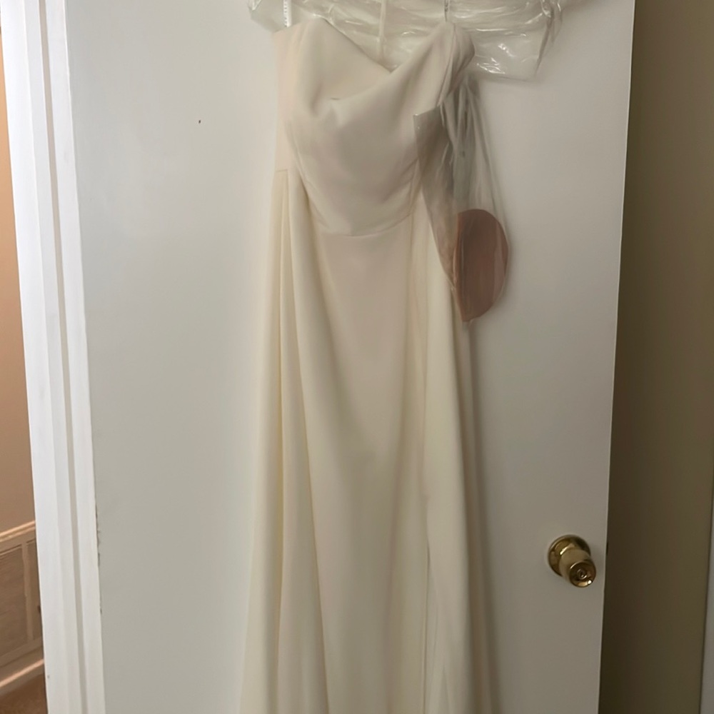 Never before worn bridesmaids dress. Size 6 ivory.